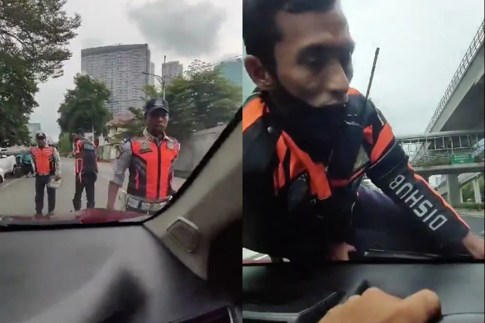 petugas dishub jakarta tersangkut di kap mobil